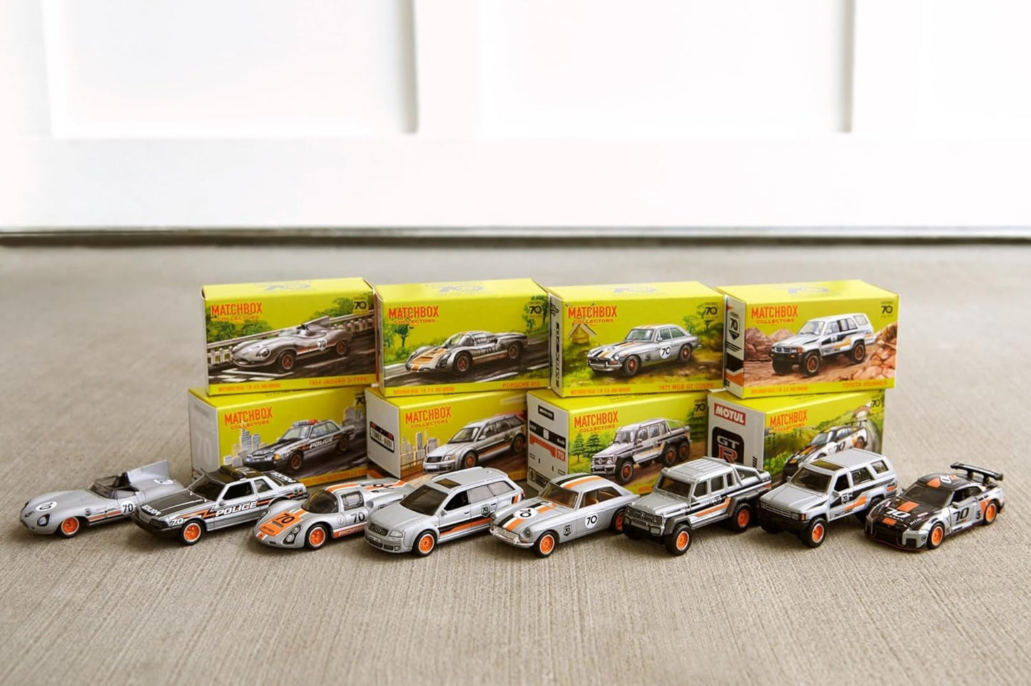 Matchbox Cars, Set of 8 Die-Cast Cars in 1:64 Scale with Premium Decos Including 1 Exclusive Vehicle, True Grip Tires, Platinum-Tone Finish, For Collectors